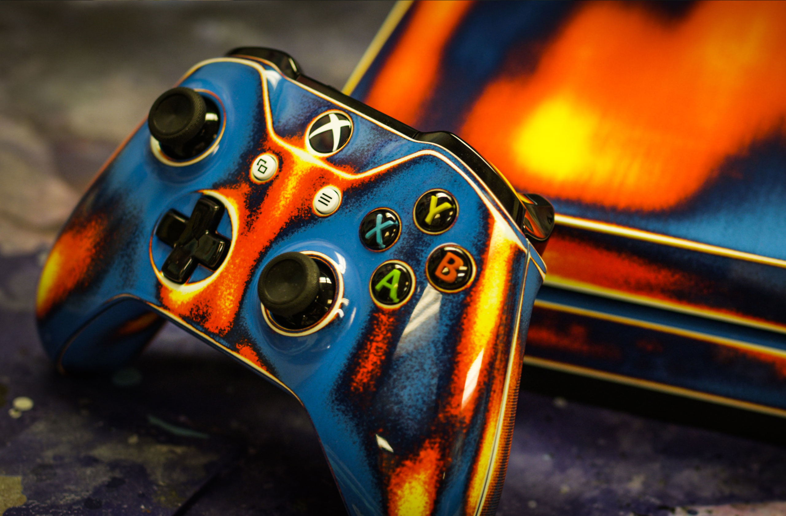 An eye-catching Xbox controller from Shmaze Custom Coatings, showcasing bold flames that ignite excitement for gaming
